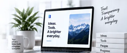 A laptop reading “Ideas. Tools. A brighter everyday.” beside a plant, a mug and books labelled Ideas, Tools, People and Progress, with the handwritten words “Trust. Transparency. A brighter everyday.”